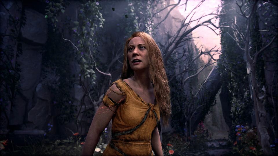 Laufey kijkt omhoog in een donker bos met kale bomen.