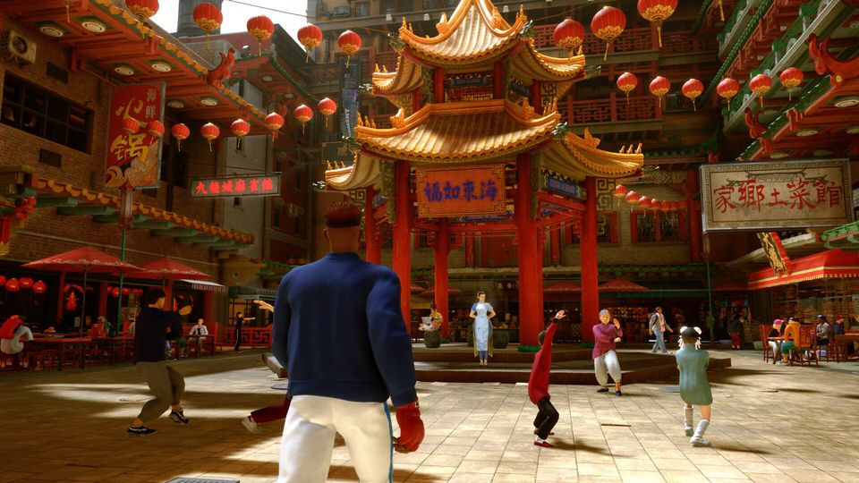 Gevecht op een kleurrijke stage in Street Fighter 6.