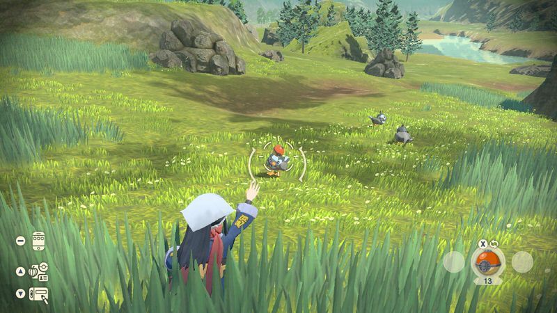Een trainer gooit een Poké Ball in Pokémon Legends: Arceus.