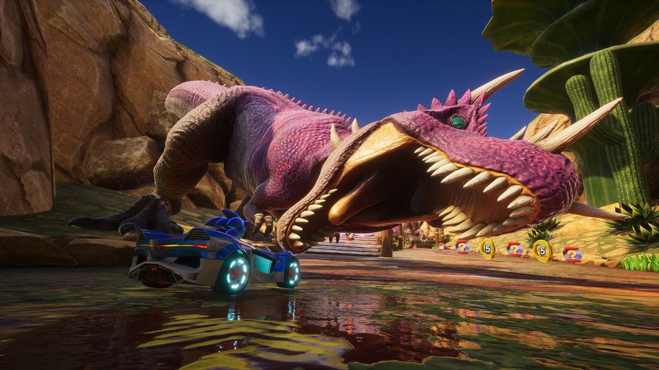 Racers op een kleurrijk circuit in Sonic Racing: CrossWorlds.